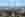 regensburg (Krankenhaus Barmherzige Brüder Regensburg) Man sieht Regensburg aus der Ferne. Viele Bäume und Dächer werden abgebildet, der Dom sticht heraus.